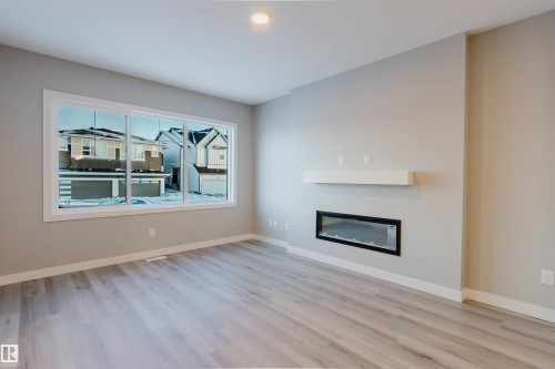 5418 69 Street, Beaumont, AB - Indoor Photo Showing Living Room With Fireplace
