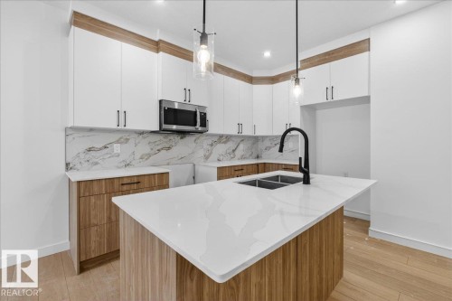 131 Creekside Lane, Leduc, AB - Indoor Photo Showing Kitchen With Double Sink With Upgraded Kitchen