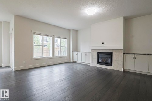 3167 Winspear Crescent Sw, Edmonton, AB - Indoor Photo Showing Living Room With Fireplace