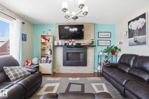 16734 122A Street, Edmonton, AB - Indoor Photo Showing Living Room With Fireplace