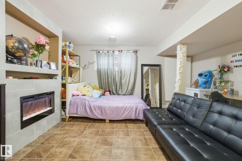 16734 122A Street, Edmonton, AB - Indoor Photo Showing Bedroom With Fireplace