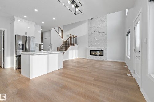 11 Westwyck, Spruce Grove, AB - Indoor Photo Showing Kitchen With Fireplace