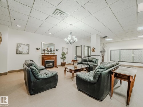 600 10149 Saskatchewan Drive, Edmonton, AB - Indoor Photo Showing Other Room With Fireplace