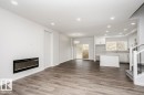 6271 29 Avenue, Edmonton, AB  - Indoor Photo Showing Living Room With Fireplace 