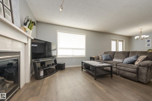 4403 151 Avenue, Edmonton, AB - Indoor Photo Showing Living Room With Fireplace