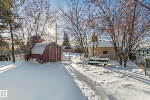 Yard covered in snow featuring a shed - 315 10 Street, Cold Lake, AB - Outdoor