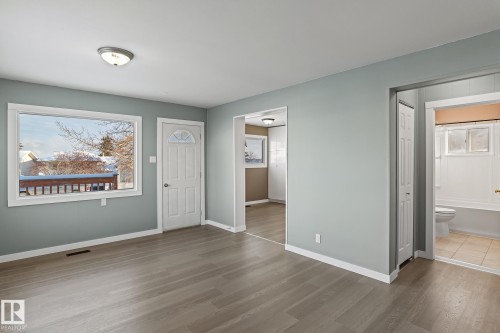 Living room with finished floors and baseboards - 315 10 Street, Cold Lake, AB - Indoor Photo Showing Other Room