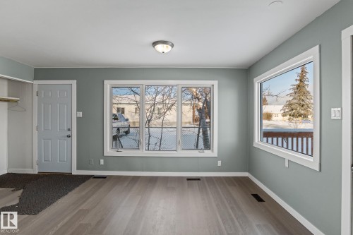 Living room with finished floors and baseboards - 315 10 Street, Cold Lake, AB - Indoor Photo Showing Other Room