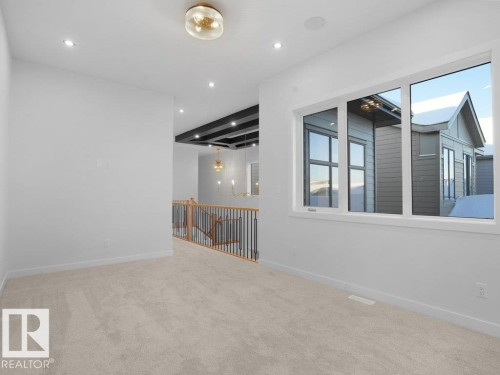 Bonus room featuring a chandelier, light colored carpet, and recessed lighting - 6131 Crawford Drive, Edmonton, AB - Indoor Photo Showing Other Room