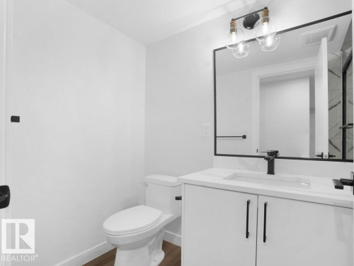 Bathroom with vanity and dark wood finished floors - 6131 Crawford Drive, Edmonton, AB - Indoor Photo Showing Bathroom