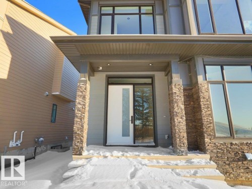 View of snow covered property entrance - 6131 Crawford Drive, Edmonton, AB - Outdoor With Exterior