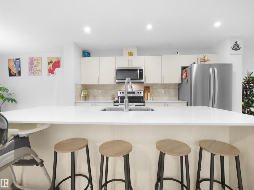 123 Stiles Link, Leduc, AB - Indoor Photo Showing Kitchen With Stainless Steel Kitchen With Double Sink With Upgraded Kitchen