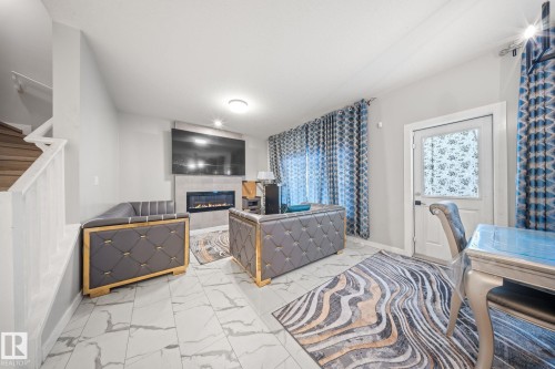 3445 Checknita Terrace, Edmonton, AB - Indoor With Fireplace