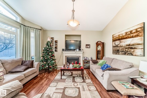 31 1407 Glastonbury Boulevard, Edmonton, AB - Indoor Photo Showing Living Room With Fireplace