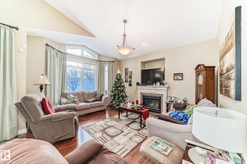 31 1407 Glastonbury Boulevard, Edmonton, AB - Indoor Photo Showing Living Room With Fireplace