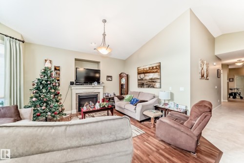 31 1407 Glastonbury Boulevard, Edmonton, AB - Indoor Photo Showing Living Room With Fireplace