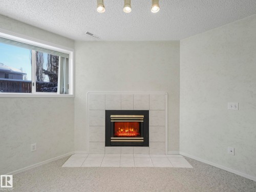 49 Aberdeen Way, Stony Plain, AB - Indoor Photo Showing Living Room With Fireplace