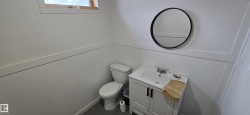 Bathroom featuring vanity and toilet - 