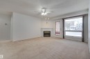 107 8903 106A Avenue, Edmonton, AB  - Indoor Photo Showing Other Room With Fireplace 