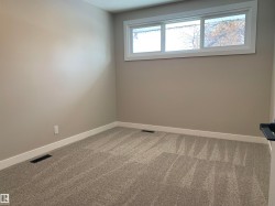Empty room featuring baseboards and carpet - 