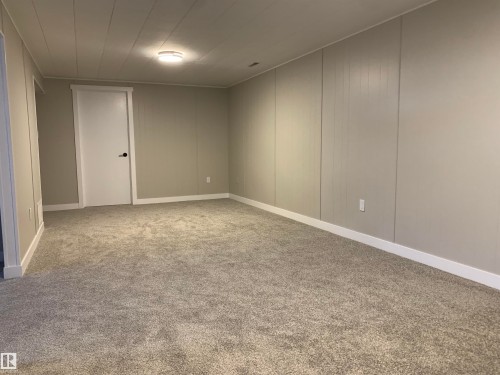 Unfurnished room with light carpet and baseboards - 10816 163 Street, Edmonton, AB - Indoor Photo Showing Other Room
