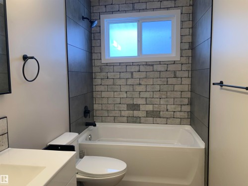 Full bath featuring vanity and shower / tub combination - 10816 163 Street, Edmonton, AB - Indoor Photo Showing Bathroom