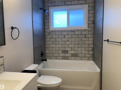 Full bath featuring vanity and shower / tub combination - 