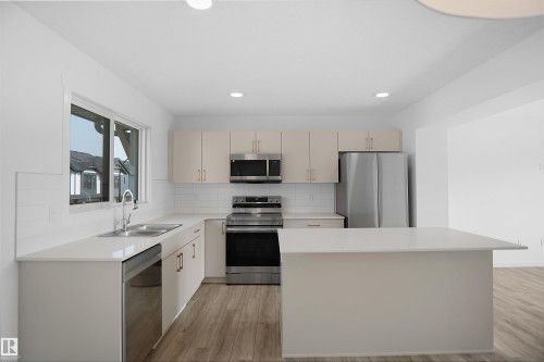 73 1025 Secord Promenade Promenade, Edmonton, AB - Indoor Photo Showing Kitchen With Double Sink With Upgraded Kitchen