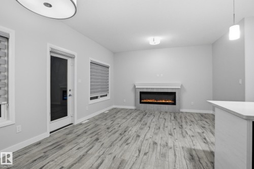 7438 Chivers Crescent, Edmonton, AB - Indoor Photo Showing Living Room With Fireplace