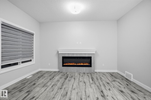 7438 Chivers Crescent, Edmonton, AB - Indoor Photo Showing Living Room With Fireplace