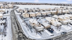 Snowy aerial view featuring a residential view - 