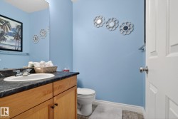 Bathroom featuring vanity and baseboards - 