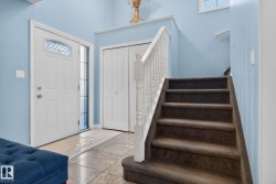 Entrance foyer featuring stairs - 