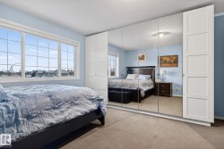 Carpeted bedroom featuring a closet and a textured ceiling - 