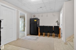 Entrance foyer featuring light tile patterned floors - 