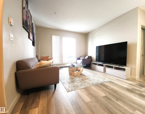 403 1004 Rosenthal Boulevard, Edmonton, AB - Indoor Photo Showing Living Room