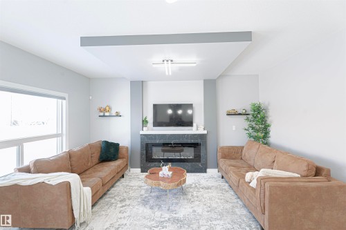 1524 17 Avenue, Edmonton, AB - Indoor Photo Showing Living Room With Fireplace