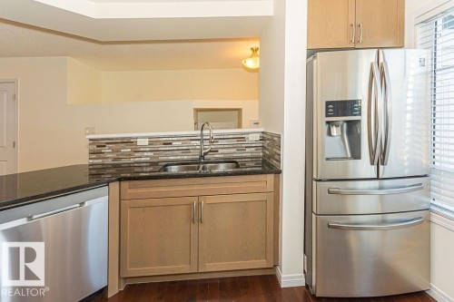24 1140 Chappelle Boulevard, Edmonton, AB - Indoor Photo Showing Kitchen With Double Sink