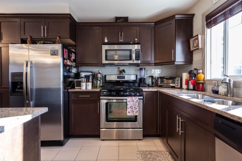 52 1150 Windermere Way, Edmonton, AB - Indoor Photo Showing Kitchen With Double Sink