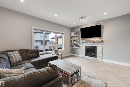 3901 44 Avenue, Beaumont, AB - Indoor Photo Showing Living Room With Fireplace