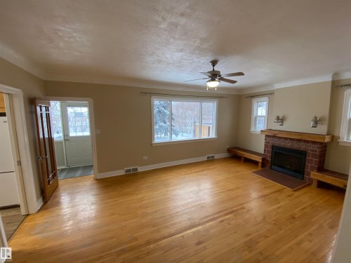 4809 54A Avenue, Vegreville, AB - Indoor Photo Showing Other Room With Fireplace