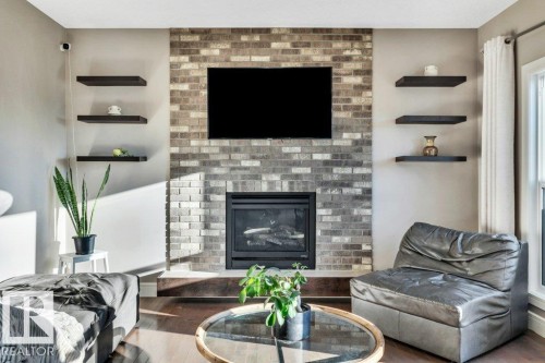 7647 181 Avenue, Edmonton, AB - Indoor Photo Showing Living Room With Fireplace