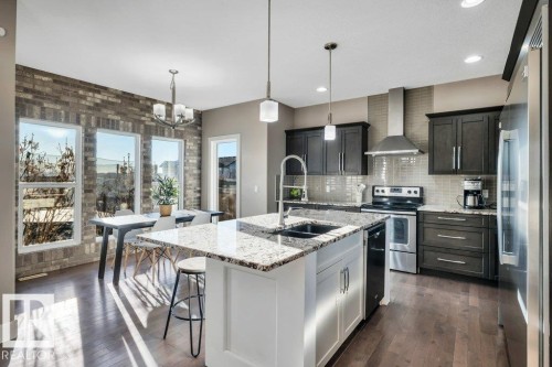 7647 181 Avenue, Edmonton, AB - Indoor Photo Showing Kitchen With Stainless Steel Kitchen With Double Sink With Upgraded Kitchen