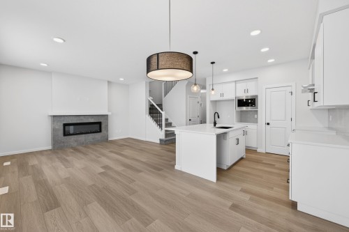 17427 3 Street, Edmonton, AB - Indoor Photo Showing Kitchen With Fireplace