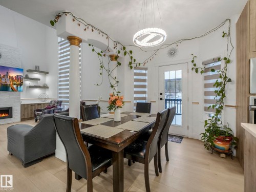 572 Butterworth Way, Edmonton, AB - Indoor Photo Showing Dining Room With Fireplace