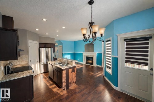 2825 16A Avenue, Edmonton, AB - Indoor Photo Showing Kitchen With Fireplace