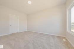 Spare room featuring light carpet and recessed lighting - 