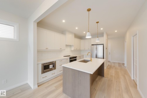 207 Stonehouse Way, Leduc, AB - Indoor Photo Showing Kitchen With Stainless Steel Kitchen With Upgraded Kitchen