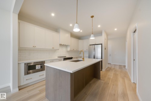 207 Stonehouse Way, Leduc, AB - Indoor Photo Showing Kitchen With Stainless Steel Kitchen With Upgraded Kitchen