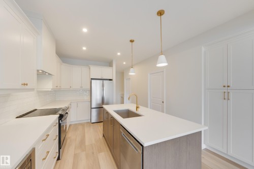 207 Stonehouse Way, Leduc, AB - Indoor Photo Showing Kitchen With Stainless Steel Kitchen With Upgraded Kitchen